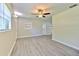 Living room featuring stylish gray wood flooring and natural light at 475 W Ethelene St, Bartow, FL 33830
