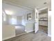 A bright, open living space featuring newly installed wood flooring with a view of the updated kitchen at 475 W Ethelene St, Bartow, FL 33830
