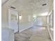 Spacious room featuring gray wood flooring and natural light at 475 W Ethelene St, Bartow, FL 33830