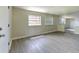 Spacious living area with updated floors, neutral paint, and a well-lit atmosphere for relaxation at 475 W Ethelene St, Bartow, FL 33830