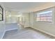 Spacious room featuring gray wood flooring and natural light at 475 W Ethelene St, Bartow, FL 33830