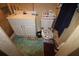 Bathroom with a white vanity, toilet, and patterned floor mat at 515 Cassandra Ln, Lakeland, FL 33809