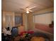 Bedroom featuring a ceiling fan and two closets at 515 Cassandra Ln, Lakeland, FL 33809