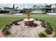 Neighborhood street view with homes and landscaped yards with a fountain feature at 515 Cassandra Ln, Lakeland, FL 33809