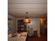 Dining area featuring wood floors, paneled ceiling, chandelier, and built-in hutch at 515 Cassandra Ln, Lakeland, FL 33809