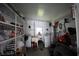 Garage interior with shelves, window, white walls, laundry hook ups, and storage at 515 Cassandra Ln, Lakeland, FL 33809