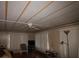 Cozy living room with comfortable furniture, large windows, paneled ceilings, and wood-look floors at 515 Cassandra Ln, Lakeland, FL 33809
