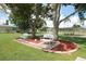 Park view with benches, mulch bed, and shady trees at 515 Cassandra Ln, Lakeland, FL 33809