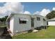 Rear exterior of home with windows, siding, and backyard at 515 Cassandra Ln, Lakeland, FL 33809