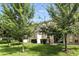 Landscaped backyard with healthy lawn and manicured hedges in a residential neighborhood at 1143 Presidential Ln, Apopka, FL 32703