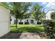 Beautiful backyard with lush green lawn and manicured hedges, perfect for outdoor enjoyment at 1143 Presidential Ln, Apopka, FL 32703