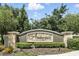 Ambergate community sign with manicured landscaping adds charm to the neighborhood entrance at 1143 Presidential Ln, Apopka, FL 32703