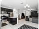 Spacious living room featuring modern appliances and an island at 1143 Presidential Ln, Apopka, FL 32703