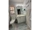 Cozy bathroom featuring a stylish single vanity and modern fixtures at 204 Madison St, Minneola, FL 34715