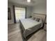Spacious bedroom with natural light and neutral decor at 204 Madison St, Minneola, FL 34715