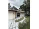 Charming single story home featuring a garden walkway and attractive brick accents at 204 Madison St, Minneola, FL 34715