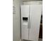 White refrigerator with water and ice dispenser at 204 Madison St, Minneola, FL 34715