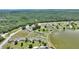 This aerial shows a beautiful lake side community, serene, lush with green scenery at 4711 Club Cir, Lakeshore, FL 33854