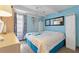 Bright bedroom featuring stylish flooring, a ceiling fan, and blue accent wall at 4711 Club Cir, Lakeshore, FL 33854