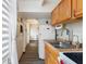 Functional kitchen layout with wood cabinets, modern appliances, and ample natural light at 4711 Club Cir, Lakeshore, FL 33854