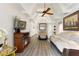 Spacious living room with a ceiling fan, a fireplace, and comfortable seating at 4711 Club Cir, Lakeshore, FL 33854