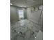 Bright bedroom with marble floors, soft lighting, and a modern floral wall decor at 10090 Se 67Th Ter, Belleview, FL 34420
