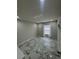 Sunny bedroom featuring marble floors and plenty of natural light, creating a bright and airy atmosphere at 10090 Se 67Th Ter, Belleview, FL 34420