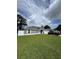 Charming single-story home featuring a well-maintained lawn and attached two car garage at 10090 Se 67Th Ter, Belleview, FL 34420