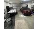 Spacious garage featuring ample storage space and a sports car at 10090 Se 67Th Ter, Belleview, FL 34420