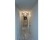 Hallway with decorative lighting and marble tile flooring at 10090 Se 67Th Ter, Belleview, FL 34420