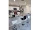Modern kitchen with granite countertops, stainless steel appliances, and bar seating, perfect for entertaining and everyday living at 10090 Se 67Th Ter, Belleview, FL 34420