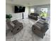 Spacious living room with marble tile flooring and contemporary furnishings at 10090 Se 67Th Ter, Belleview, FL 34420