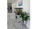 Bright living room featuring elegant marble floors and an aquarium with a decorative plant, creating a serene atmosphere at 10090 Se 67Th Ter, Belleview, FL 34420