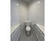 Efficient half bathroom with modern fixtures, white cabinets, and corner toilet at 13774 Meadowpark Ave, Orlando, FL 32826