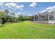 Expansive backyard featuring a well-maintained lawn and a serene pond, offering a private retreat at 2925 Deerbrook Dr, Lakeland, FL 33811