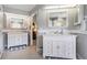 Elegant bathroom featuring double vanities with marble countertops, providing ample space and storage at 2925 Deerbrook Dr, Lakeland, FL 33811