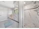 Contemporary bathroom showcasing a soaking tub, walk-in shower with sleek white tiles, and modern fixtures at 2925 Deerbrook Dr, Lakeland, FL 33811