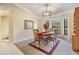Cozy dining room featuring a modern chandelier and natural light from a bay window at 2925 Deerbrook Dr, Lakeland, FL 33811