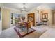 Inviting dining area featuring a modern light fixture, bay windows and adjacent entry way at 2925 Deerbrook Dr, Lakeland, FL 33811