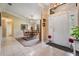 Inviting foyer with tile flooring, leading to the dining area with elegant lighting at 2925 Deerbrook Dr, Lakeland, FL 33811