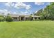 Well-manicured front yard with mature landscaping enhances the curb appeal of this lovely single-Gathering home at 2925 Deerbrook Dr, Lakeland, FL 33811