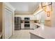 Well-lit kitchen featuring stainless steel appliances, white cabinets and eat in area at 2925 Deerbrook Dr, Lakeland, FL 33811