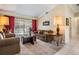 Relaxing living room with plush furniture, soft lighting, and view of the pool area at 2925 Deerbrook Dr, Lakeland, FL 33811