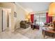 Inviting living room with plush furniture, soft lighting, and access to the pool area at 2925 Deerbrook Dr, Lakeland, FL 33811