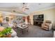 Open concept living room with neutral decor, plush seating, and seamless flow to the kitchen at 2925 Deerbrook Dr, Lakeland, FL 33811
