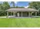 Spacious outdoor patio, perfect for dining and entertaining, complete with ceiling fans and ample seating space at 2925 Deerbrook Dr, Lakeland, FL 33811