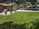 Spacious front yard with a well-manicured lawn and driveway leading to a single Gathering home at 909 Heatherbrook Dr, Auburndale, FL 33823