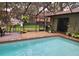 Inviting screened-in pool area with outdoor seating, perfect for relaxing and entertaining in style at 909 Heatherbrook Dr, Auburndale, FL 33823