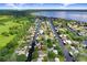 Aerial view showcasing the property's waterfront location, access to canals, and proximity to the lake at 93 Bream St, Haines City, FL 33844