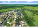 Aerial view of a waterfront home with canal access and lush greenery surrounding the area at 93 Bream St, Haines City, FL 33844